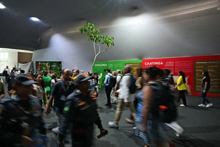 People walk along a corridor at the Cop30 venue