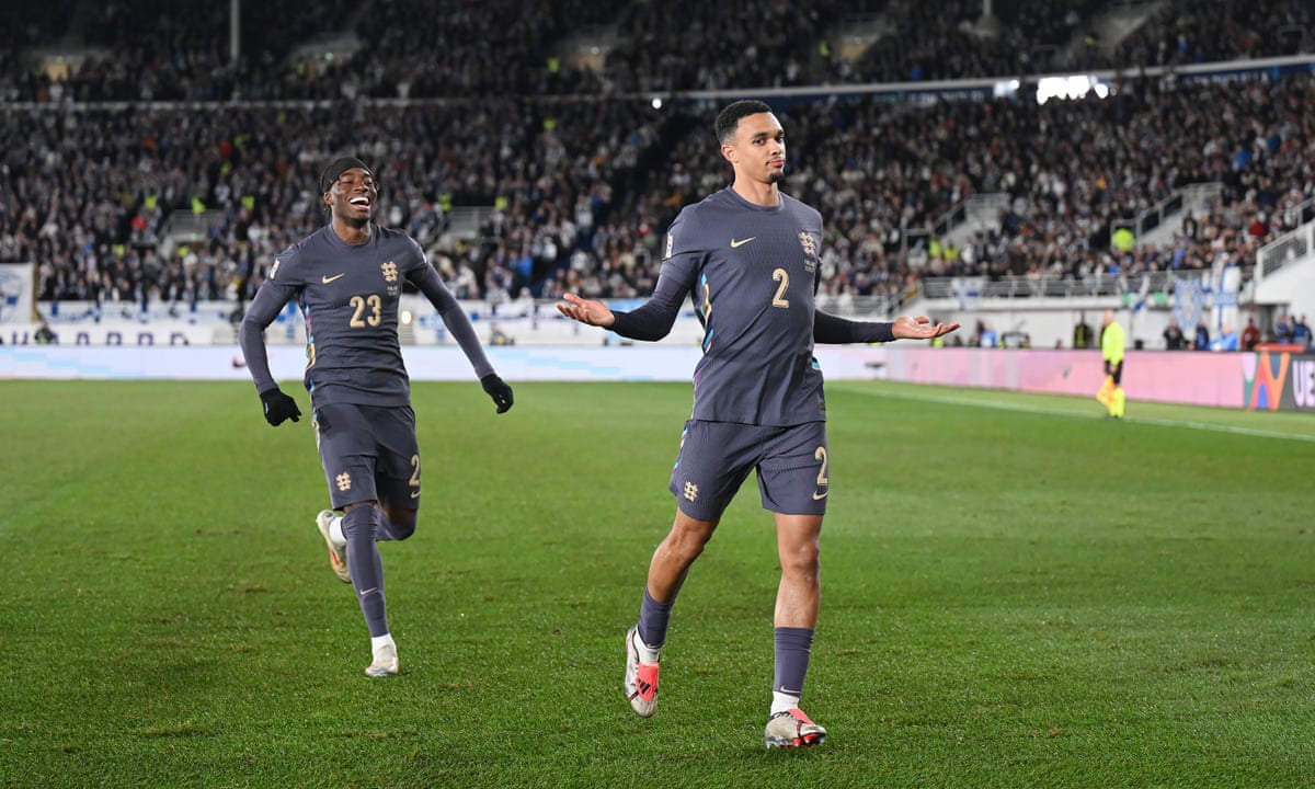 Noni Madueke celebrates with Trent Alexander-Arnold in England's win against Finland.