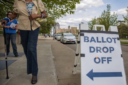 Ohio voters walk to drop off their ballots at the Board of Elections in Dayton, Ohio on April 28, 2020. On March 17, 2020 Governor Mike DeWine and Ohio Department of Health Director Amy Acton delayed Ohio primaries over coronavirus concerns. The primaries were changed exclusively to a vote-by-mail system to reduce chances of virus spread.