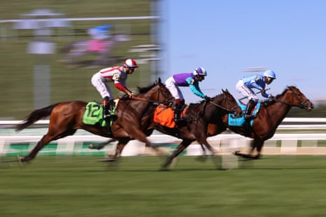 Horses compete in the third race on the opening day of the rebuilt Belmont Park in Elmont, New York, on Friday.