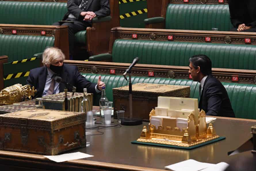 Boris Johnson congratulating Rishi Sunak at the end of Sunak’s budget speech in the Commons.