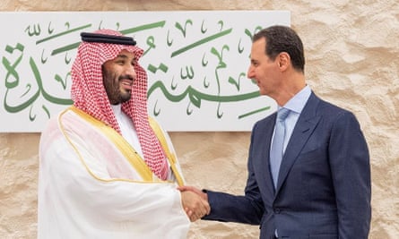 Saudi Arabia’s crown prince, Mohammed bin Salman, shakes hands with Syria’s Bashar al-Assad