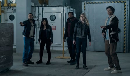 They stand amid heavy machinery, looking surprised