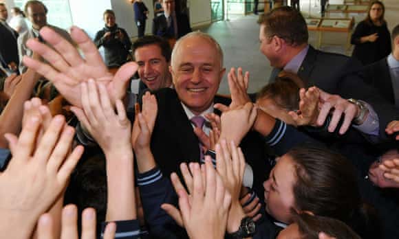 Malcolm Turnbull high-fives students at Drummoyne public school in Sydney on Thursday.