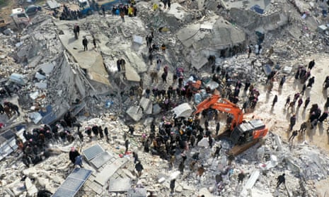 People search for survivors following the earthquake in Besnia, in Syria's rebel-held Idlib province, on Monday 6 February, 2023.   