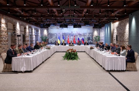 The Turkish foreign minister, Hakan Fidan (C), chairs a meeting between delegations from Russia (R) and Ukraine at Dolmabahce palace in Istanbul.