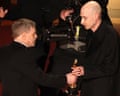 Mark Hamill presents Daniel Blumberg with the Oscar for best original score.