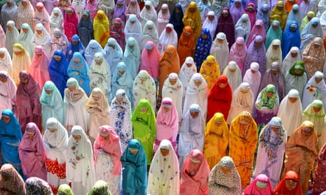 Female students attend a mass prayer session