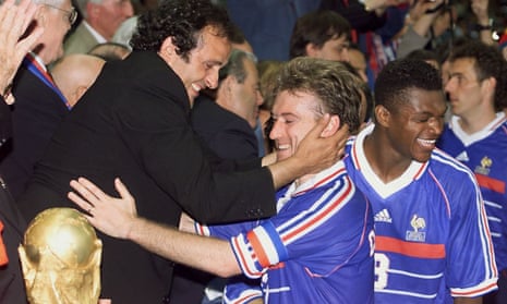 Michel Platini is pictured celebrating with France captain Didier Deschamps after the hosts beat Brazil in the 1998 World Cup final in Paris.