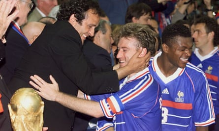 Captain Didier Deschamps receives the World Cup from Michel Platini in 1998, closely followed by friend and teammate Marcel Desailly