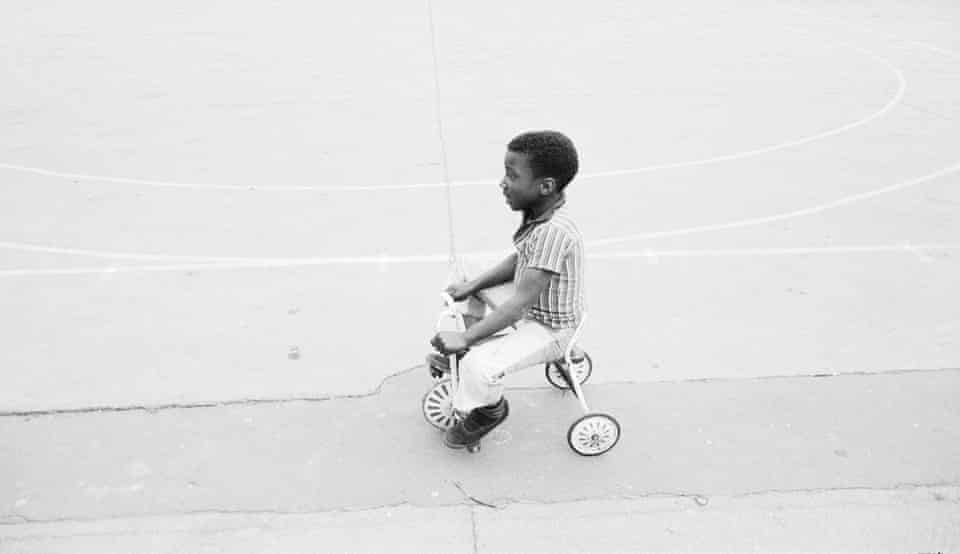 Boy on a tricycle.