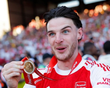 Declan Rice shows off his medal.