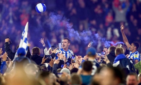 Harry Toffolo (centre) celebrates their win with the Huddersfield Town fans.