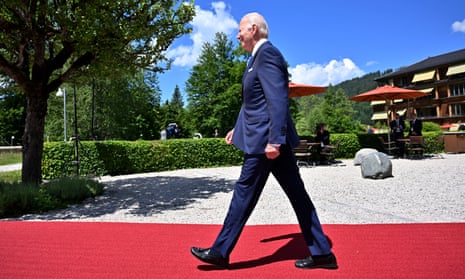 Joe Biden walking on a red carpet