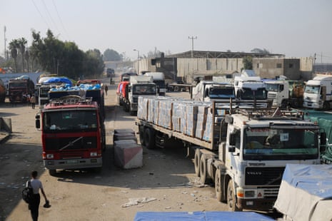 Humanitarian aid trucks entering through the Kerem Shalom crossing from Israel into the Gaza Strip on 18 December