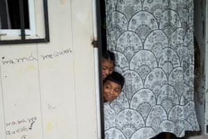 Siblings Alicia and Omar Rodriguez, whose parents have been out of work for four weeks, play at home after banana producer Chiquita Panama laid off some 5,000 of its daily workers amid an ongoing strike