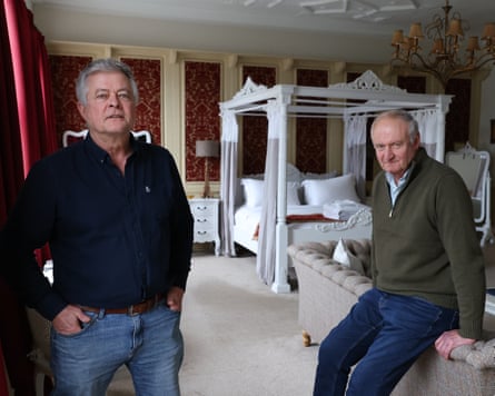 Nicholas Evans and Michael Webb in one of the pub’s bedrooms, with a white four-poster bed in the background.