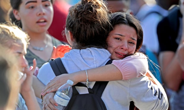 Students are released from lockdown on 14 February at Marjory Stoneman Douglas High School in Parkland, Florida.