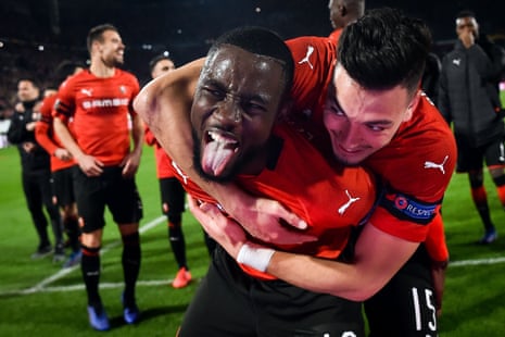 Rennes’ James Lea Siliki and Ramy Bensebaini (right) celebrate their 3-1 victory over Arsenal.
