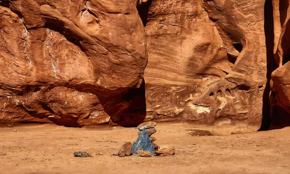Rocks mark the location where a metal monolith once stood in the ground in a remote area of red rock in Spanish Valley, Utah, south of Moab near Canyonlands national park.