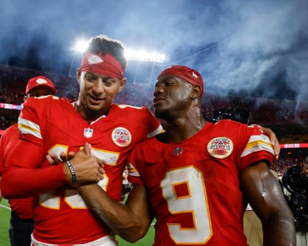 Kansas City Chiefs quarterback Patrick Mahomes (left) and runningback Kenneth Walker III celebrate as they walk off the field