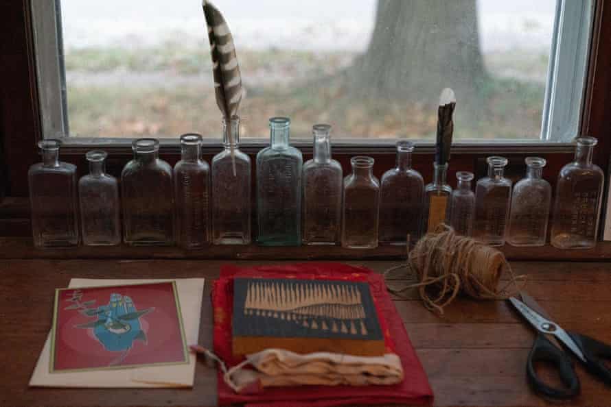 Various pieces of artwork and aged solid bottles astatine Jessica Dore’s home.