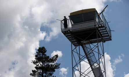 Nick Dutton surveys the landscape at the Kowen Forest fire tower near Canberra.