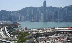 West Kowloon train station and the skyline of Hong Kong Island.