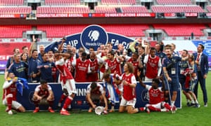 Pierre-Emerick Aubameyang drops the FA Cup after the win against Chelsea