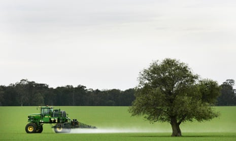 Tractor spraying a paddock