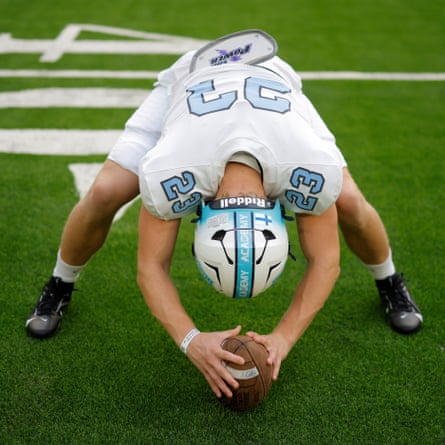 NFL Academy offensive lineman Terho Vainio from Helsinki, Finland practicing his snaps during warm up on the pitch before the match against De La Salle Spartans from California at the Tottenham Hotspur Stadium.
