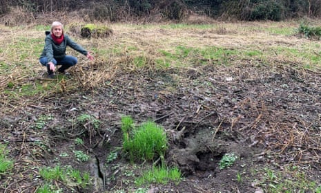 Councillor Lisa Smart examines the council-owned toxic land in Romiley.