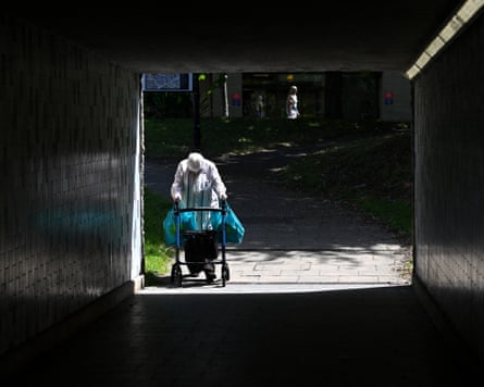A person using a mobility walker enters an underpass in Huddersfield, UK.