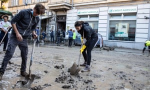 People clean up after the floods in Ventimiglia in northern Italy