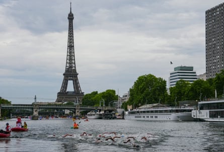 Swimmers compete in the men’s 10km open-water swimming event in the Seine