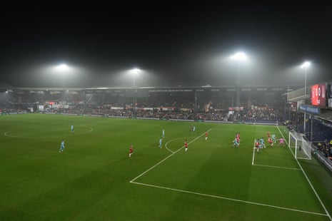 Kyle McAdam (second right) tucks the ball past Luton Town keeper James Shea to put the visitors ahead.