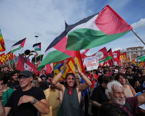 People take part in a demonstration part of a nationwide protest and general strike against the killings in Gaza, in Rome.