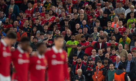 Manchester United fans stand in silence to honour the Queen before the club’s Europa League game against Real Sociedad on Thursday.
