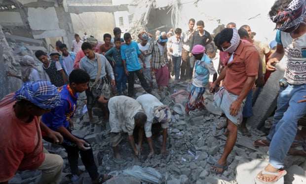 People search for survivors under rubble at the prison complex