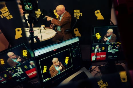 Screen monitors featuring two people talking at a table