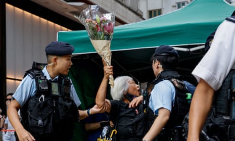 Police detain Alexandra Wong, a pro-democracy activist better known as Grandma Wong, on Sunday