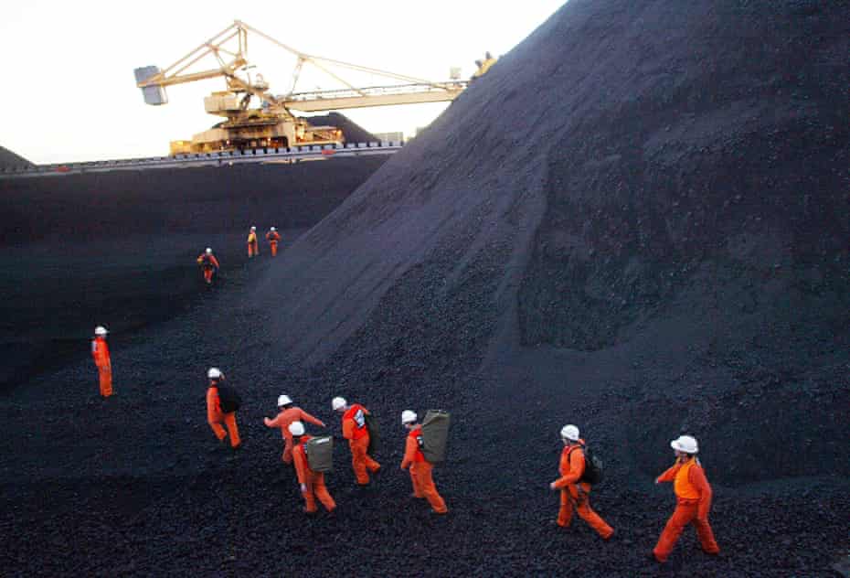 Greenpeace activists disrupt coal loading at the world’s largest coal port