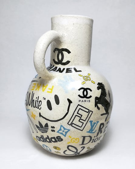 A Greek-style vase by Rapiditas decorated with various brand logos.