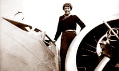 This 20 May 1937 photo shows Earhart on the wing of her Electra plane, taken by Albert Bresnik at Burbank Airport in Burbank, California.