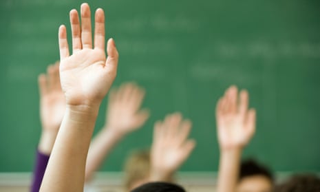 hands raised in a classroom