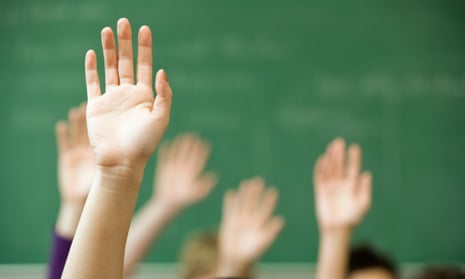 Hands raised in a classroom