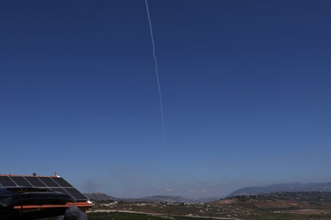 A white line in a clear sky from a projectile being intercepted.