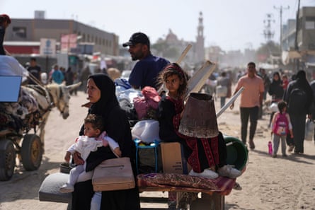 Palestinians fleeing with their possessions