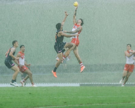 Rain poured down during during the AFL Community Series match between the GWS Giants and the Sydney Swans at Henson park in Sydney on Thursday night