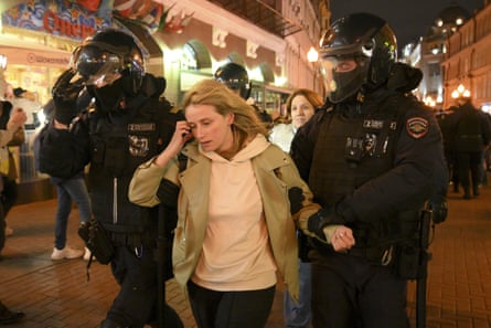 Riot police detain a demonstrator during a protest against mobilization in Moscow last night.